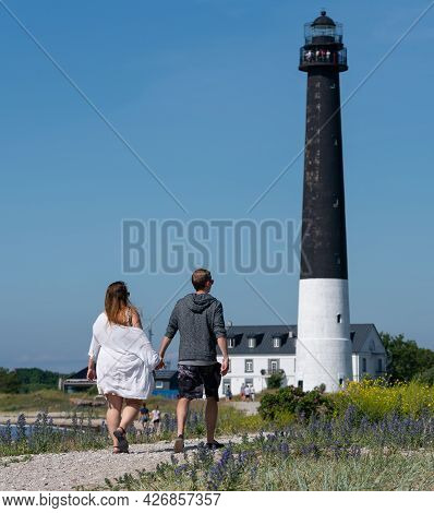 Sorvesaar, Estonia-06.21.2021: Lighthouse At The End Of Sorve Saar Peninsula. Tall Beacon Of Light F
