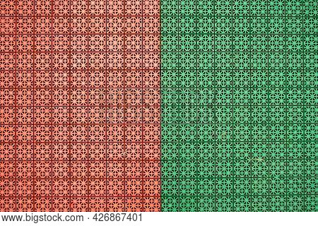 Orange And Green Mix Rubber Coatings Designed From Non-slip Squares. It Was Made For Outdoor Exercis