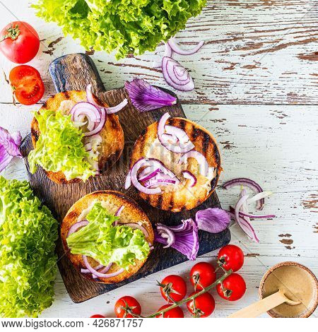 Making Homemade Burger. Ngredients For Cooking On A Wooden Table. Top View.