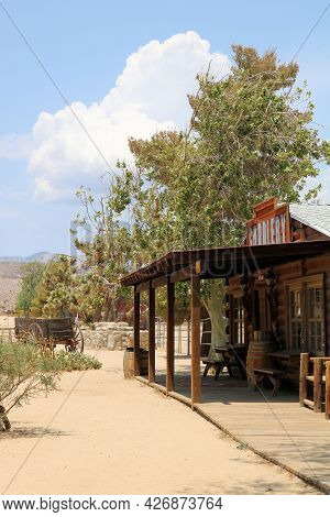 July 14, 2021 In Pioneertown, Ca:  Wooden Boardwalk Besides Vintage Wooden Buildings Taken In Pionee