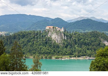 Panorama Of The Bled Lake, Blejsko Jezero, With Its Castle, Blejski Hrad, During A Cloudy Summer Wit