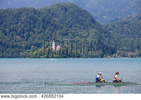 Bled, Slovenia - June 13, 2021: Two Young Female Adults, Rowers, On A Coxless Pair Four, A Rowing Bo