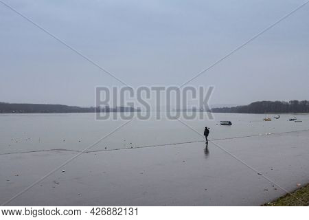 Belgrade, Serbia - January 31, 2016: Man Walking Alone Near The Danube River During A Heavily Foggy 
