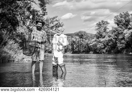 Weekend With Family. Happy Fishermen Friendship. Fly Fish Hobby Of Businessman. Retirement Fishery. 