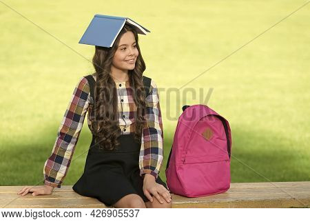 Fun Filled Learning. Funny Child Hold Book On Head. School Library. Reading Education. Knowledge And