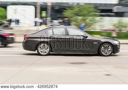 Moscow, Russia - May 2021: Bmw 5 Series On The Road In Motion. Fast Speed Drive On City Road. Side V