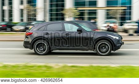 Moscow, Russia - May 2021: Infiniti Qx70 Moving Fast On The Street Of Moscow. Black Shiny Mid-size L