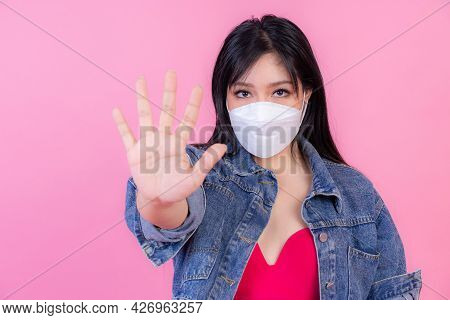 Asian Girl Wearing Face Mask Show Stop Hands Gesture For Stop Corona Virus Outbreak , Protect Spread