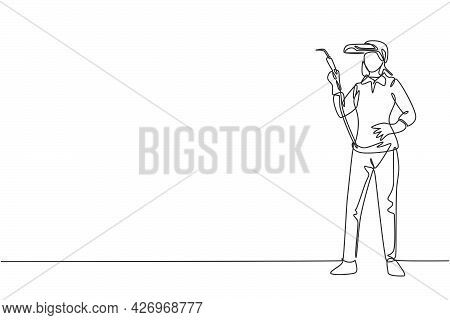 Continuous One Line Drawing Of Young Beauty Female Welder Holding Weld Nozzle With Hands On Hip. Pro