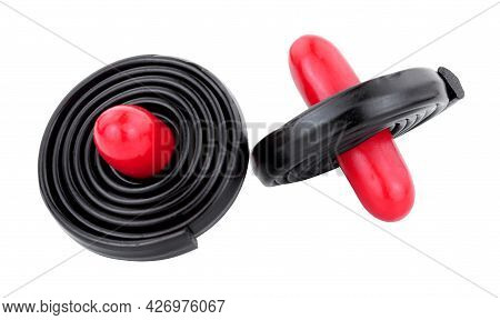 Liquorice Spinning Tops, Soft Liquorice Strips Wrapped Around A Red Liquorice Torpedo Isolated On A 