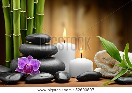 zen basalt stones and orchid on the wood