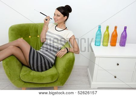 Young Woman Dressed In Retro Style With Cigarette Smiling