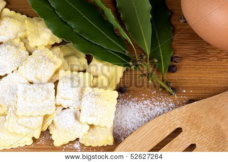 Italian pasta ravioli with flour eggs herbs bay leaf