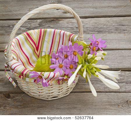 A Bouquet Of  Hosta And Cosmos In A Basket
