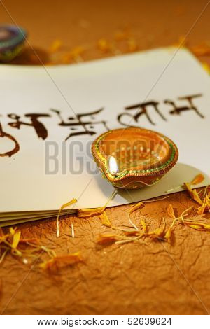 Indian traditional lamps on a religious book