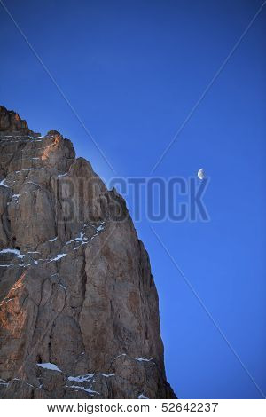 Rocks At Early Morning And Blue Sky With Moon