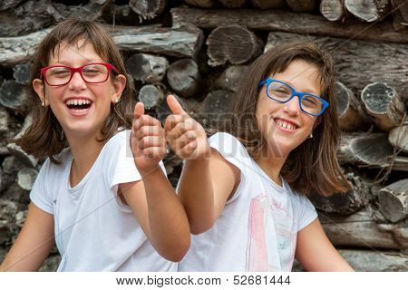 Two Kids Doing Thumbs Up.