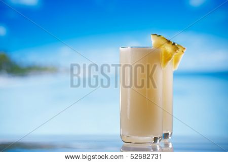 pinacolada pina colada cocktail on beach