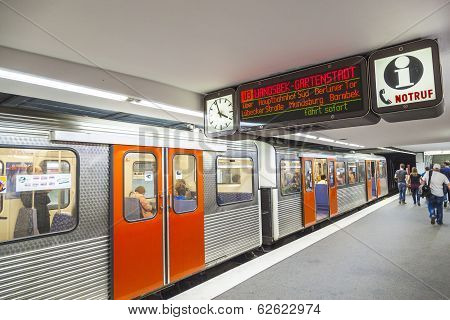 People In The Metro Station With Train In Motion