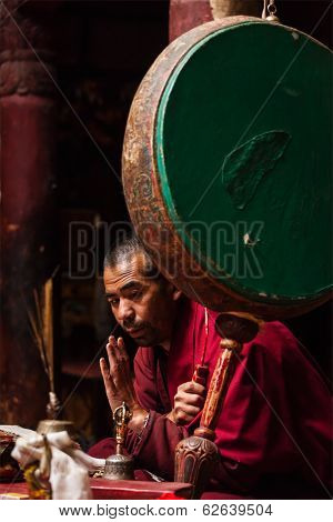 DISKIT, INDIA - SEPTEMBER 12, 2012: Unidentified Tibetan Buddhist monk praying in Hemis gompa, Ladakh