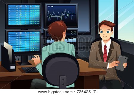 Stock Trader Looking At The Stock Market Monitors