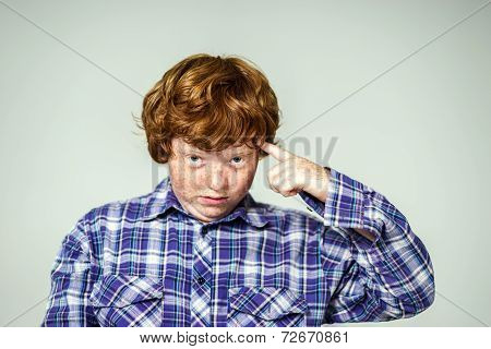 Emotional Portrait Of Red-haired Boy