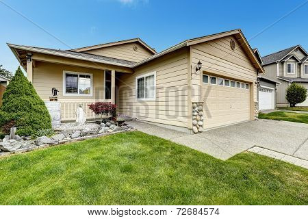 House Exterior With Stone Trim. Entance Porch And Front Yard Design