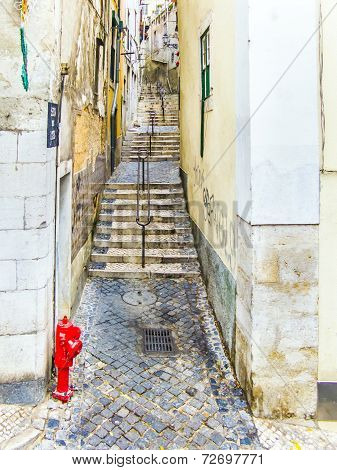 Cobble Stone Street In Old Town Of Lisbon