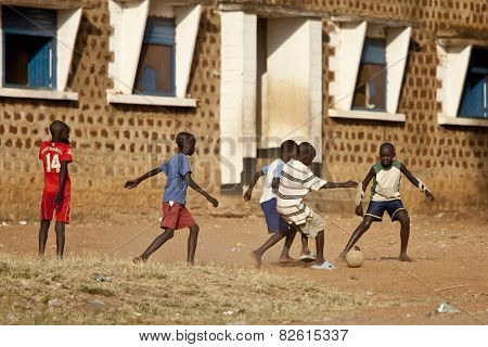 TORIT, SOUTH SUDAN- FEBRUARY 20, 2013: Unidentified children play football in a village in South Sudan