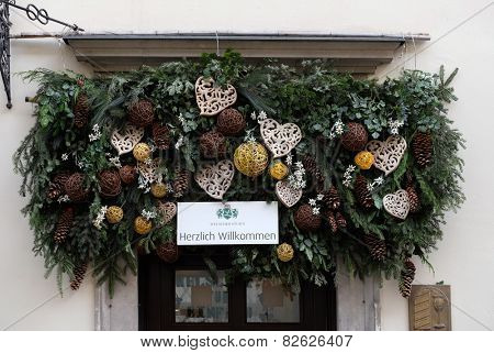 GRAZ, AUSTRIA - JANUARY 10, 2015: Christmas arrangement over entrance in Welscher Stubn restaurant, Schmiedgasse, Graz, Styria, Austria on January 10, 2015.