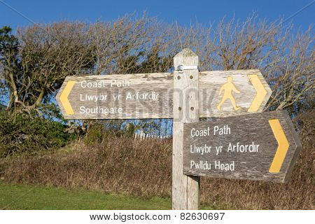 A signpost for the Wales Coast Path between Southgate and Pwlldu Head on the Gower, South Wales, UK