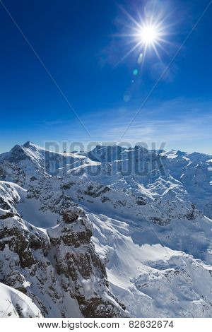 Beautiful view from the Swiss mountain Titlis towards the South. On the horizon from left to right you can see the mountains Sustenhorn, Dammastock, Tierberge and Diechterhorn.