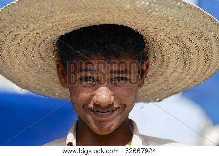 Portrait of young man wearing a straw hat in Taizz, Yemen.
