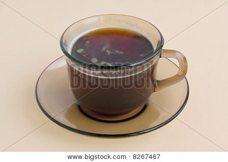 A Cup Of Brown Glass With Coffee