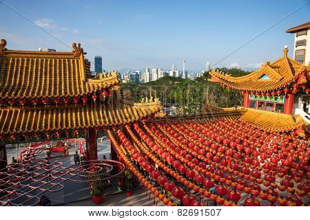 KUALA LUMPUR, MALAYSIA - FEBRUARY 08, 2015: Tourists visit the scenic Thean Hou Temple with up hundreds of lanterns hung across the courtyard. This is in preparation for the coming Chinese New Year.