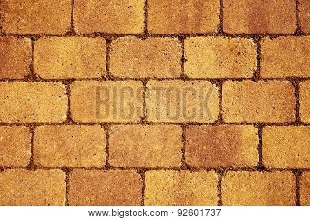 closeup of a orange stone wall or stone pavement background