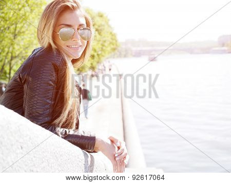 Portrait of young woman. Natural sunflare