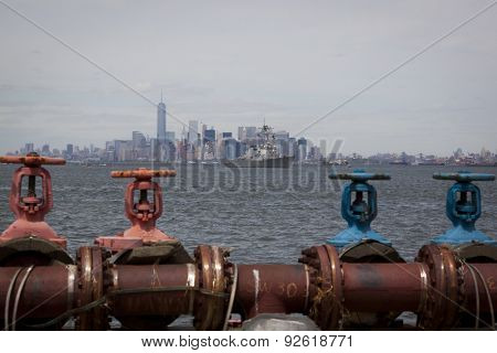 STATEN ISLAND, NY - MAY 20 2015: USS Barry (DDG 52) heads away from Lower Manhattan on the Hudson River towards Sullivans Pier after the Parade of Ships, which begins Fleet Week.