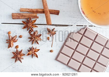 Cinnamon Stick, Star Anise, Bar Of Chocolate And Cup Of Tea
