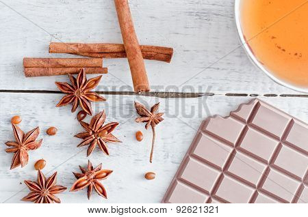 Cinnamon Stick, Star Anise, Bar Of Chocolate And Cup Of Tea