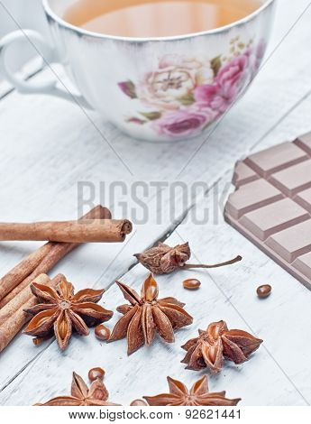 Cinnamon Stick, Star Anise, Bar Of Chocolate And Cup Of Tea