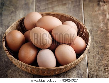 Easter Egg In A Basket On Wodden Table