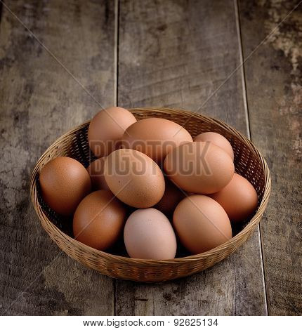 Egg In A Basket On Wodden Table