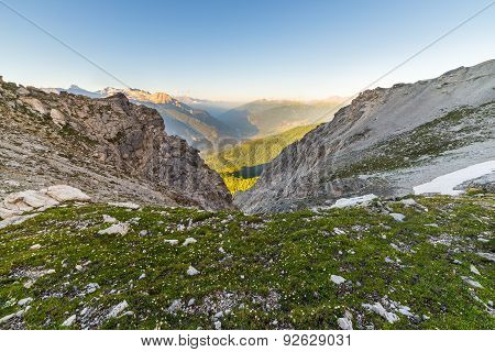 Glowing Alpine Valley And Flowering Meadow