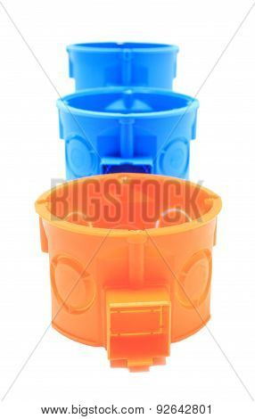 Orange And Blue Electrical Boxes On White Background