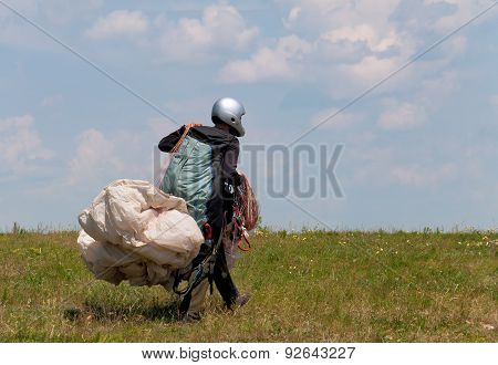 Paraglider Prepares To Fly Over Beautiful Bakota Reservoir.