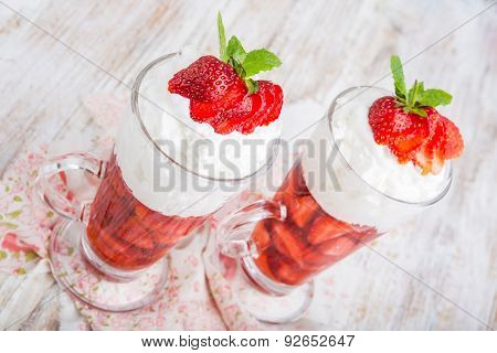 Strawberries In Jelly Topped With Whipped Cream