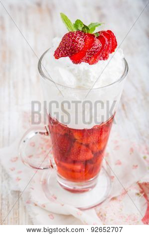 Strawberries In Jelly Topped With Whipped Cream