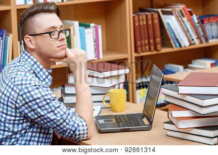 Young student working in a library