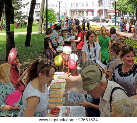 Visitors Take A Good Look At Books On The Stalls